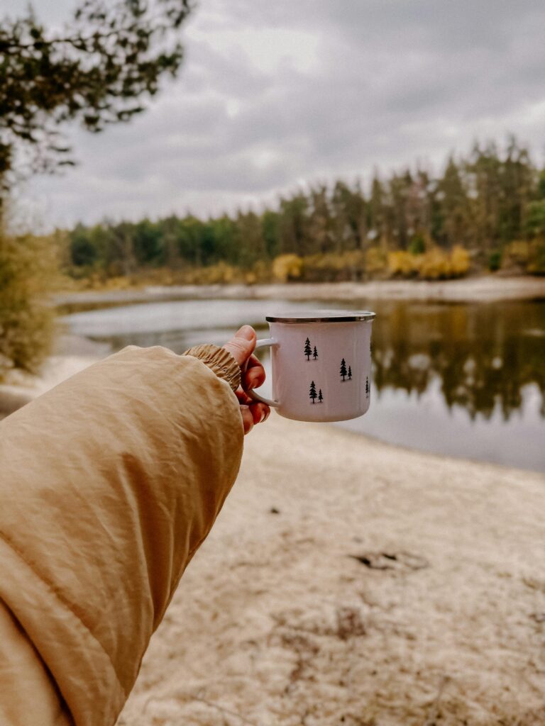 pexels-photo-34183223-34183223 cozy fall outdoor scene with mug